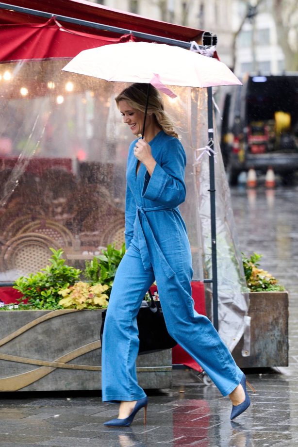 Charlotte Hawkins - Wearing a denim belted jumpsuit ona  rain day in London